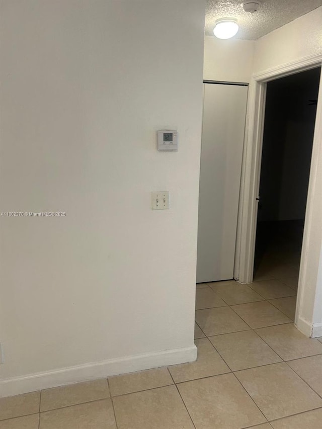 3310 N Pinewalk Dr N Unit 1814, Margate, FL 33063 - hallway featuring light tile patterned flooring and a textured ceiling