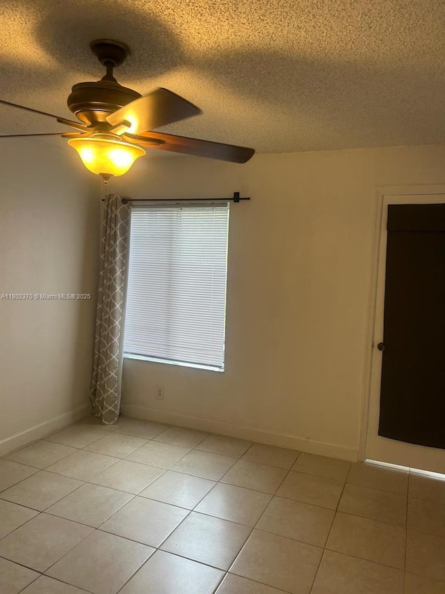 3310 N Pinewalk Dr N Unit 1814, Margate, FL 33063 - spare room featuring a textured ceiling, a ceiling fan, and light tile patterned floors