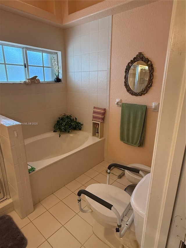 8943 NW 174th St, Hialeah, FL 33018 - full bath with tile patterned flooring, toilet, and a garden tub