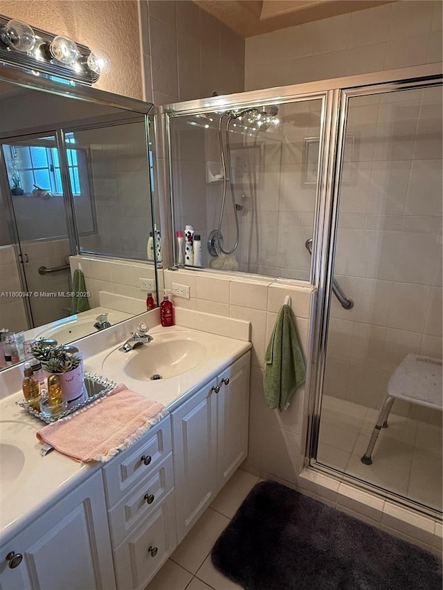 8943 NW 174th St, Hialeah, FL 33018 - full bath with a stall shower, double vanity, and tile patterned flooring