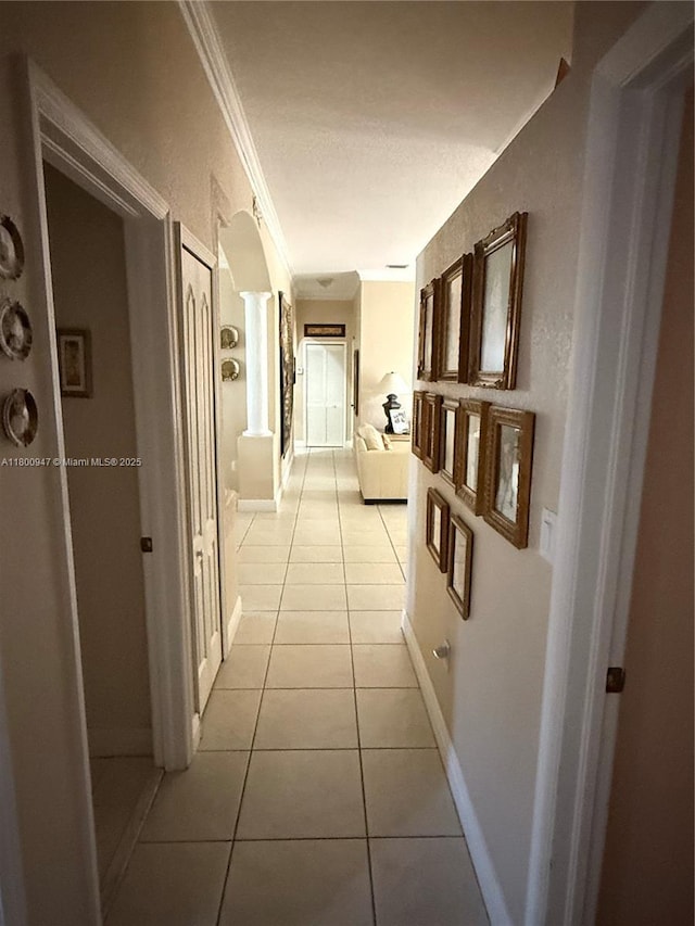 8943 NW 174th St, Hialeah, FL 33018 - hall with light tile patterned floors, crown molding, and baseboards
