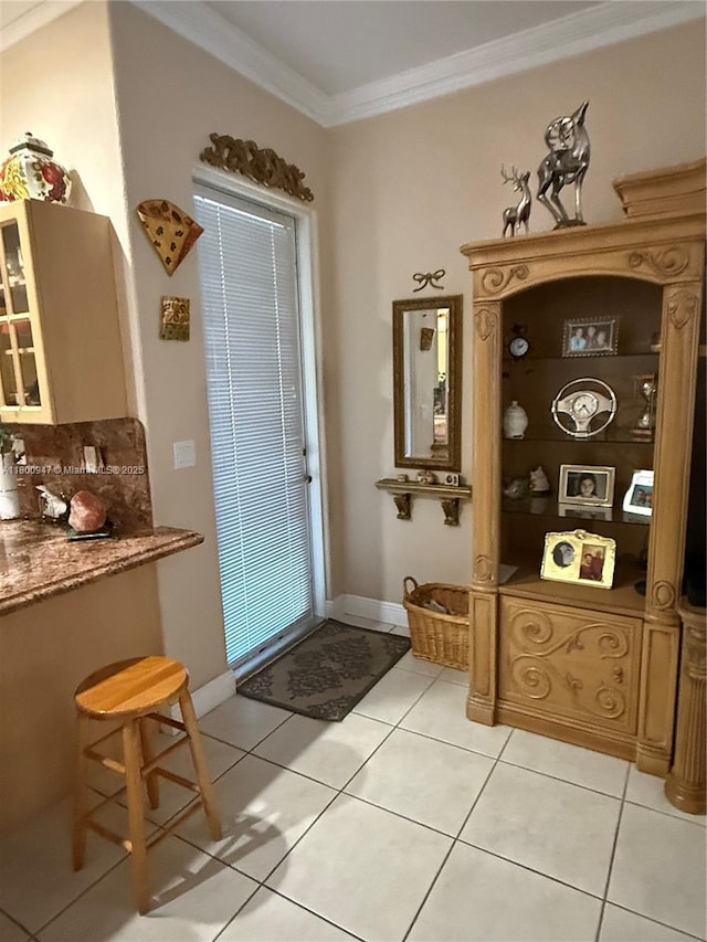 8943 NW 174th St, Hialeah, FL 33018 - doorway featuring ornamental molding, light tile patterned flooring, and baseboards