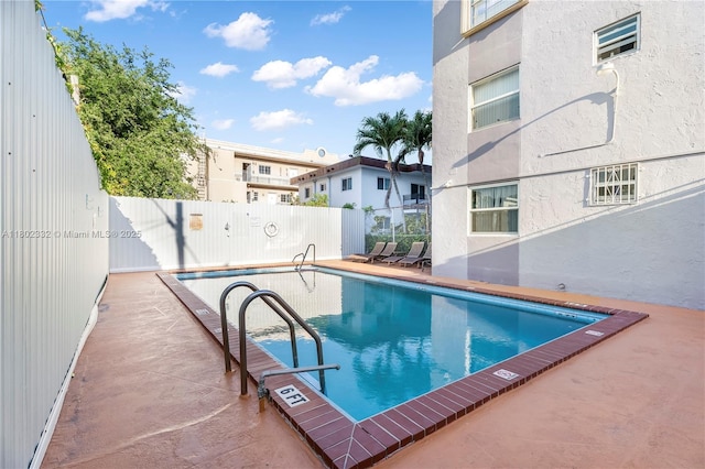 1661 SW 3rd St Unit 8, Miami, FL 33135 - community pool featuring fence and a patio area