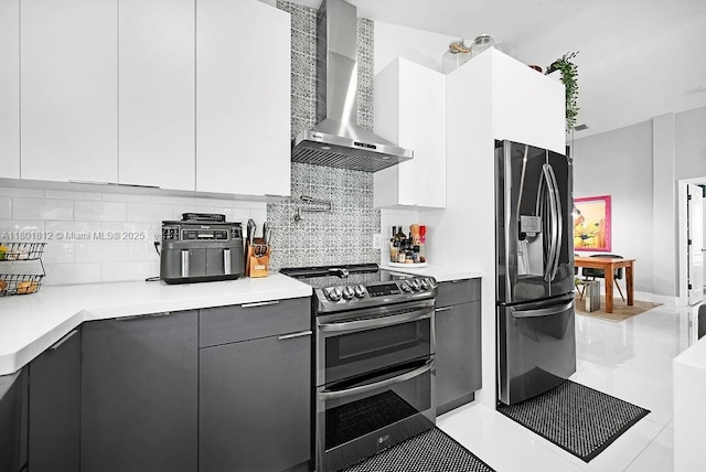 1550 SW 194th Ave, Pembroke Pines, FL 33029 - kitchen featuring wall chimney exhaust hood, stainless steel appliances, light countertops, and modern cabinets