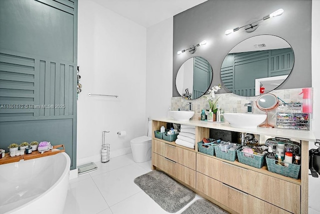 1550 SW 194th Ave, Pembroke Pines, FL 33029 - full bath with tile patterned flooring, backsplash, a freestanding bath, toilet, and double vanity