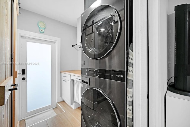 1550 SW 194th Ave, Pembroke Pines, FL 33029 - clothes washing area with stacked washer / drying machine and light wood-type flooring
