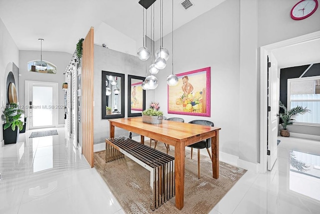 1550 SW 194th Ave, Pembroke Pines, FL 33029 - dining space with tile patterned floors, lofted ceiling, and baseboards