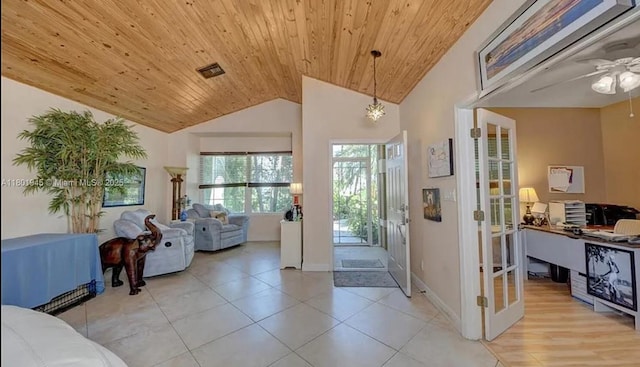 2014 SE Mantua St, Port St Lucie, FL 34952 - entrance foyer with vaulted ceiling, wood ceiling, french doors, ceiling fan, and baseboards