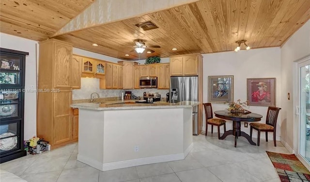 2014 SE Mantua St, Port St Lucie, FL 34952 - kitchen with wood ceiling, stainless steel appliances, light tile patterned flooring, a kitchen island, and a sink