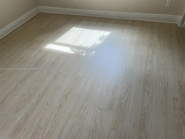 2014 SE Mantua St, Port St Lucie, FL 34952 - spare room with wood finished floors and baseboards