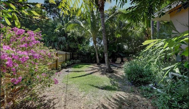 2014 SE Mantua St, Port St Lucie, FL 34952 - view of yard featuring fence