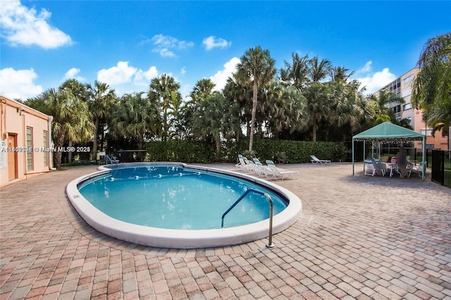 1425 Atlantic Shores Blvd Unit 502, Hallandale Beach, FL 33009 - community pool featuring a patio area