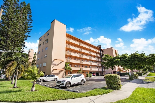 1425 Atlantic Shores Blvd Unit 502, Hallandale Beach, FL 33009 - view of apartment building / complex with uncovered parking