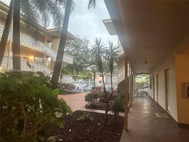 view of home's community featuring fence and a gate