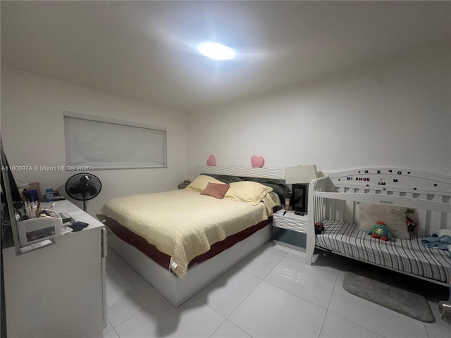 bedroom featuring light tile patterned floors