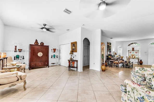 2819 Augusta Ln, Homestead, FL 33035 - living room featuring ceiling fan, light tile patterned flooring, and arched walkways
