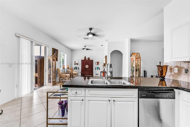 2819 Augusta Ln, Homestead, FL 33035 - kitchen with stainless steel dishwasher, a sink, a ceiling fan, a peninsula, and white cabinets