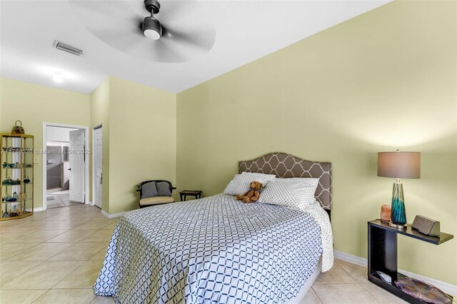 2819 Augusta Ln, Homestead, FL 33035 - bedroom with light tile patterned flooring, baseboards, ensuite bathroom, and ceiling fan