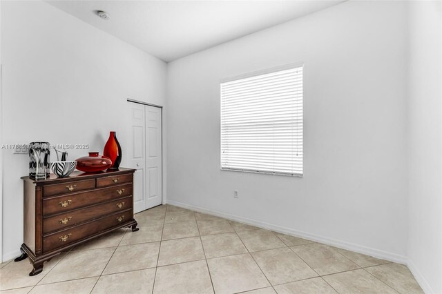 2819 Augusta Ln, Homestead, FL 33035 - bedroom with light tile patterned flooring, a closet, and baseboards