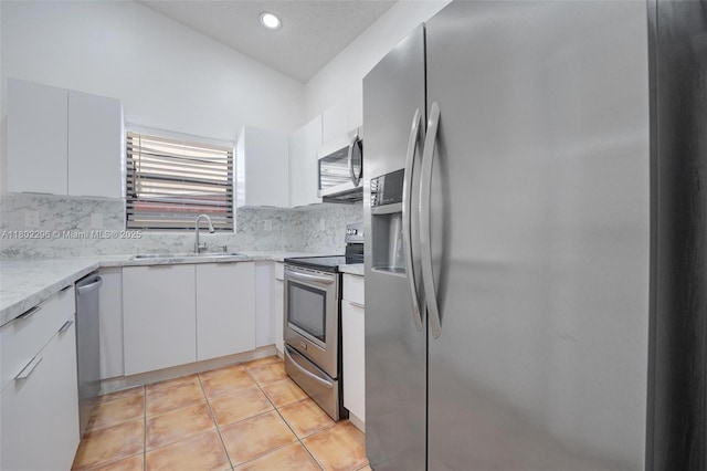 14431 SW 111th Ter, Miami, FL 33186 - kitchen featuring stainless steel appliances, a sink, white cabinets, tasteful backsplash, and recessed lighting