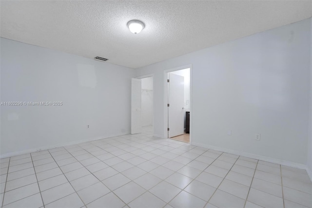 14431 SW 111th Ter, Miami, FL 33186 - spare room featuring a textured ceiling and baseboards