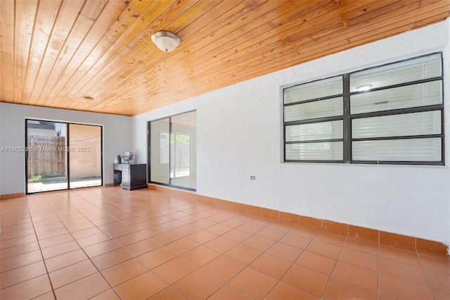 14431 SW 111th Ter, Miami, FL 33186 - unfurnished room featuring wooden ceiling and tile patterned flooring