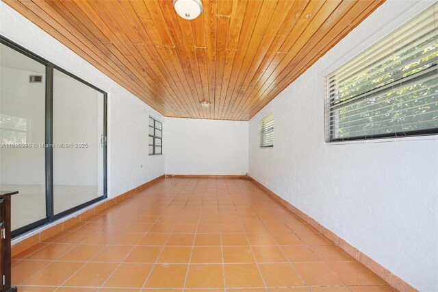 14431 SW 111th Ter, Miami, FL 33186 - tiled spare room with wooden ceiling