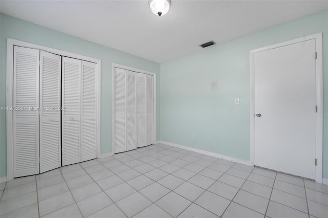 14431 SW 111th Ter, Miami, FL 33186 - unfurnished bedroom with two closets and baseboards