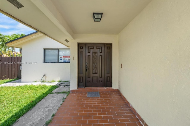 14431 SW 111th Ter, Miami, FL 33186 - view of exterior entry with stucco siding and fence