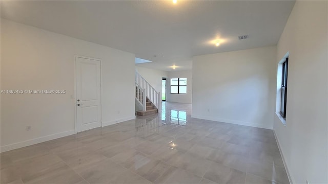 4578 SW 174th Ave, Miramar, FL 33029 - spare room featuring baseboards and stairs