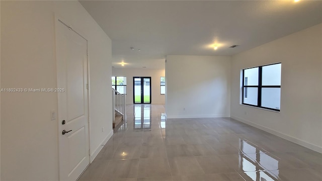 4578 SW 174th Ave, Miramar, FL 33029 - hall featuring baseboards, stairs, and light tile patterned flooring