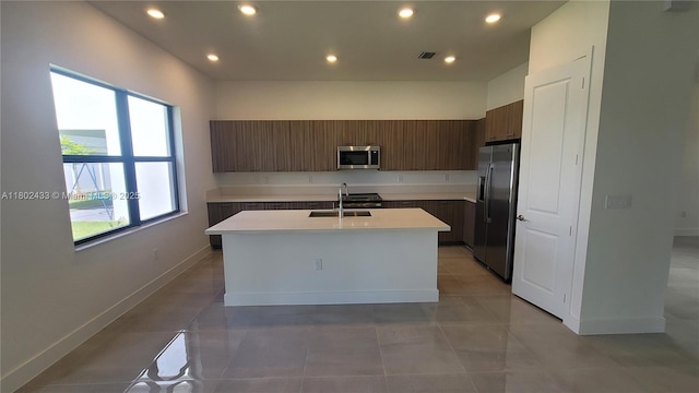 4578 SW 174th Ave, Miramar, FL 33029 - kitchen featuring appliances with stainless steel finishes, a sink, light countertops, a center island with sink, and recessed lighting