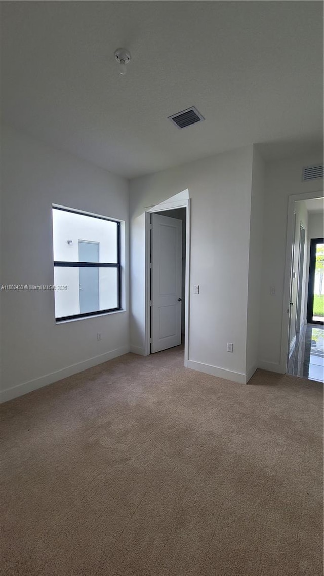 4578 SW 174th Ave, Miramar, FL 33029 - spare room with light colored carpet, baseboards, and a smoke detector