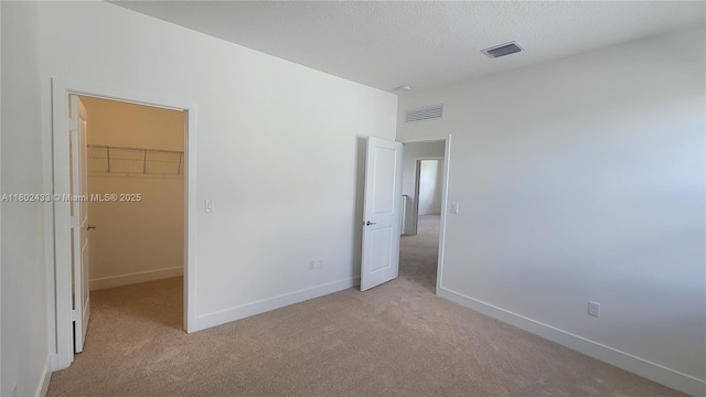 4578 SW 174th Ave, Miramar, FL 33029 - unfurnished bedroom with light carpet, a spacious closet, baseboards, and a closet