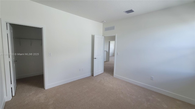 4578 SW 174th Ave, Miramar, FL 33029 - unfurnished bedroom featuring light carpet, a spacious closet, baseboards, and a closet