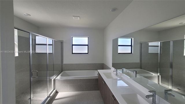 4578 SW 174th Ave, Miramar, FL 33029 - bathroom with plenty of natural light, a bath, a shower stall, and tile patterned flooring