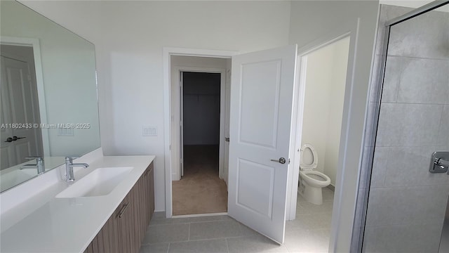 4578 SW 174th Ave, Miramar, FL 33029 - bathroom with toilet, vanity, tile patterned floors, and a stall shower