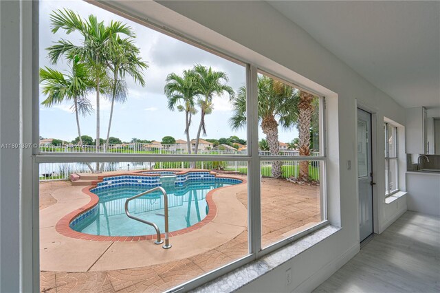 6381 Willoughby Cir, Lake Worth, FL 33463 - view of pool featuring a water view, a sink, and a pool with connected hot tub