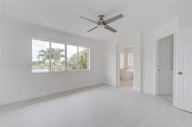 6381 Willoughby Cir, Lake Worth, FL 33463 - unfurnished bedroom with wood finished floors, ensuite bath, baseboards, and a ceiling fan