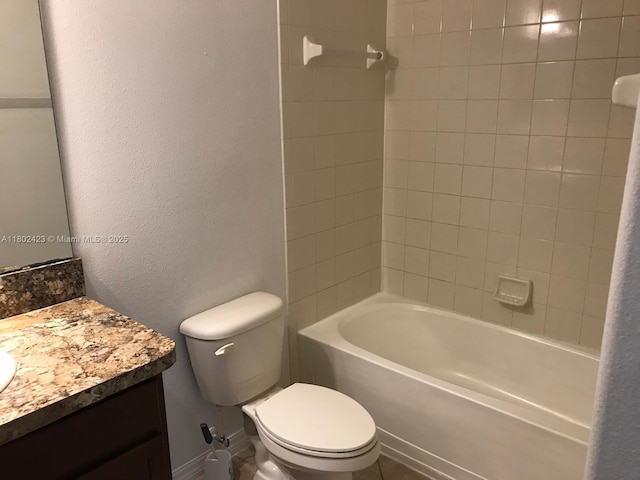 3319 Rodrick Cir, Orlando, FL 32824 - full bathroom with toilet, vanity, a textured wall, and bathtub / shower combination