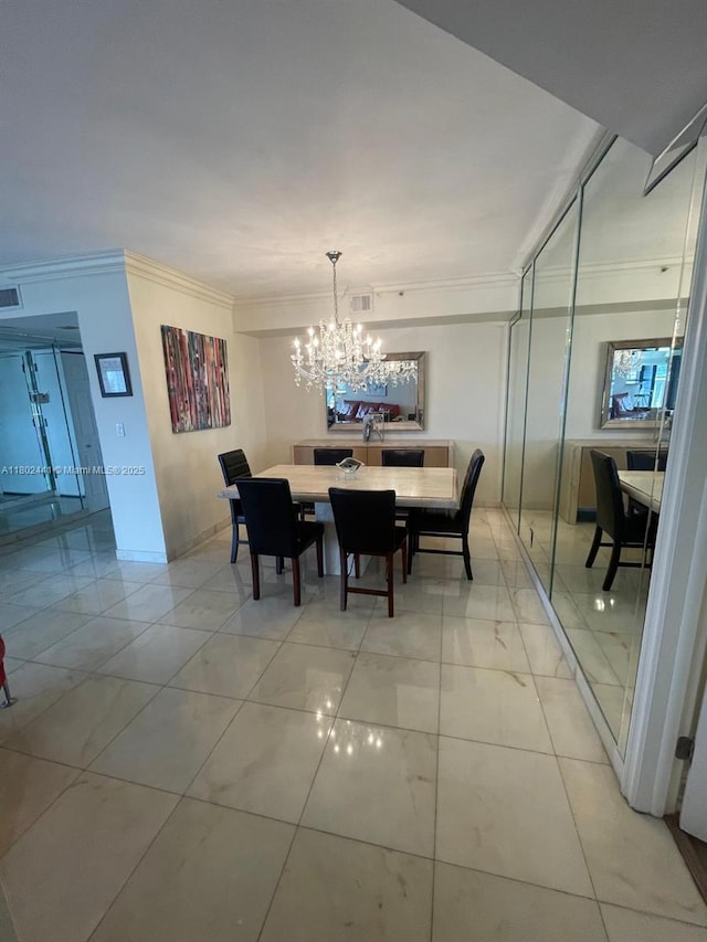 dining room with crown molding and a chandelier
