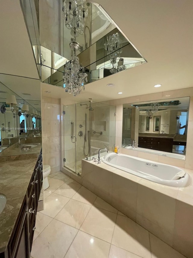 full bathroom featuring a shower stall, a bath, toilet, tile patterned floors, and double vanity