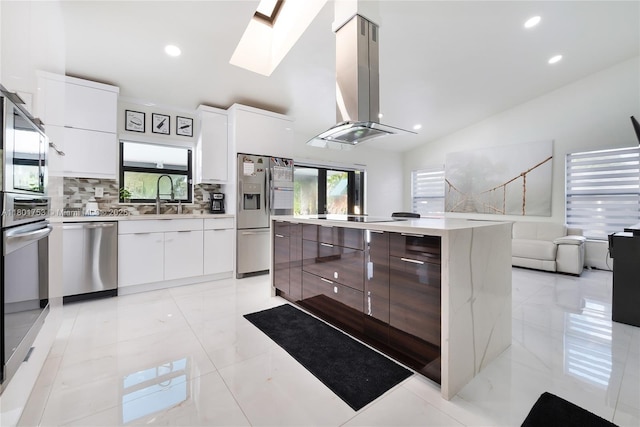 8840 SW 181st Ter, Palmetto Bay, FL 33157 - kitchen featuring modern cabinets, appliances with stainless steel finishes, island range hood, a sink, and recessed lighting