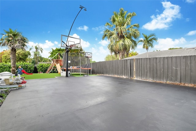 8840 SW 181st Ter, Palmetto Bay, FL 33157 - view of patio with a playground, a trampoline, and fence