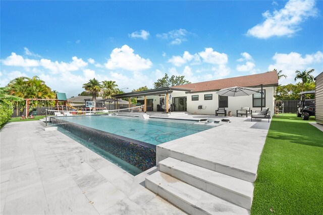 8840 SW 181st Ter, Palmetto Bay, FL 33157 - view of swimming pool with a patio