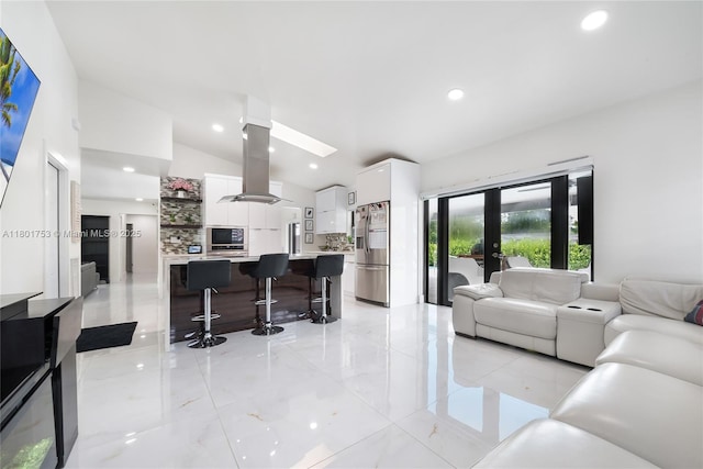 8840 SW 181st Ter, Palmetto Bay, FL 33157 - living room featuring lofted ceiling, french doors, recessed lighting, and a skylight