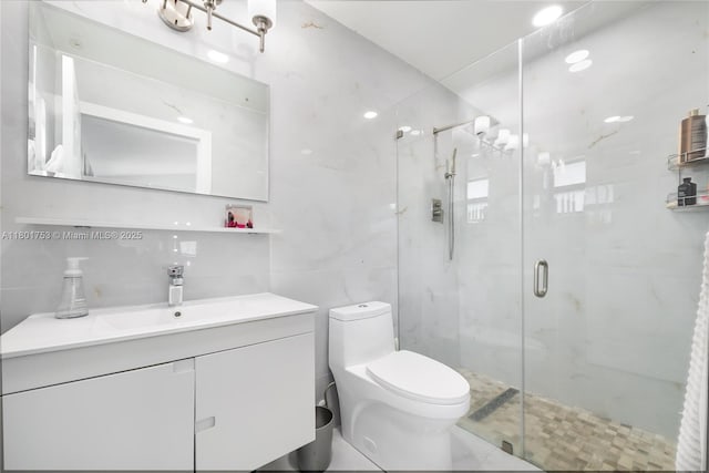 8840 SW 181st Ter, Palmetto Bay, FL 33157 - full bath featuring a stall shower, toilet, tile walls, and vanity