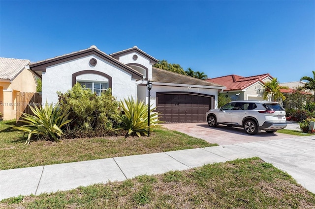 15763 SW 82nd St, Miami, FL 33193 - view of front of home featuring concrete driveway, a garage, stucco siding, a tile roof, and a front yard