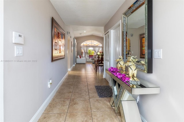 15763 SW 82nd St, Miami, FL 33193 - corridor with light tile patterned floors, vaulted ceiling, baseboards, and recessed lighting