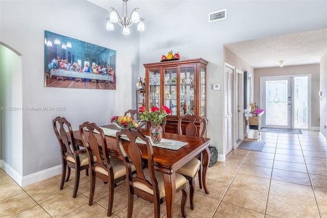 15763 SW 82nd St, Miami, FL 33193 - dining room with arched walkways, light tile patterned flooring, baseboards, and a chandelier